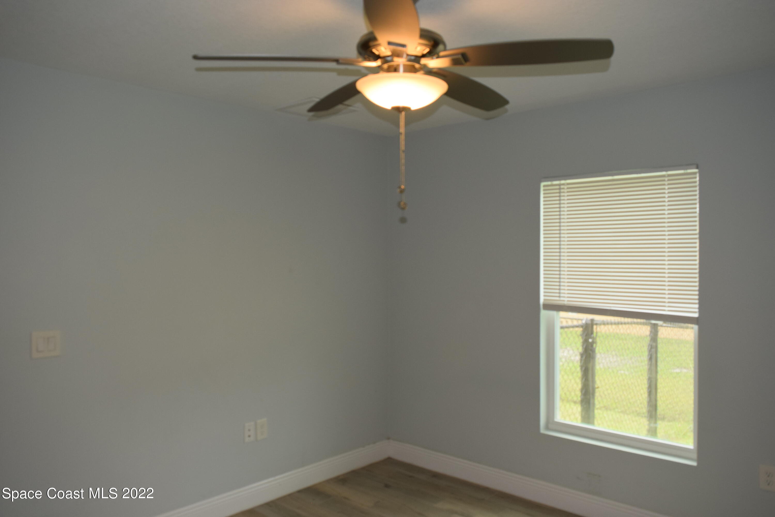 1328 Hazel Street Northwest Palm Bay, FL 32907 - Photo 15 of 28 a window in an empty room