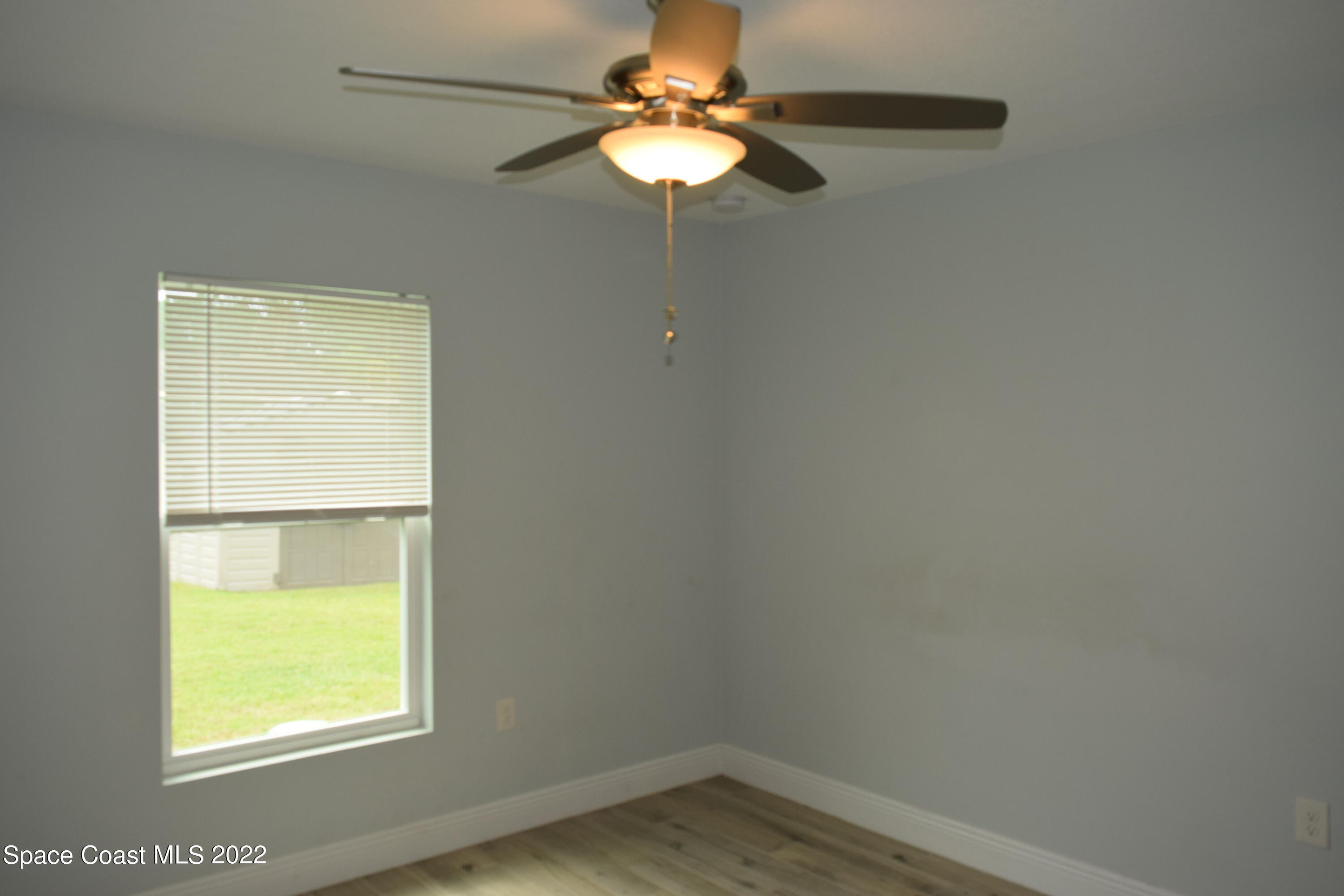 1328 Hazel Street Northwest Palm Bay, FL 32907 - Photo 18 of 28 a window in an empty room