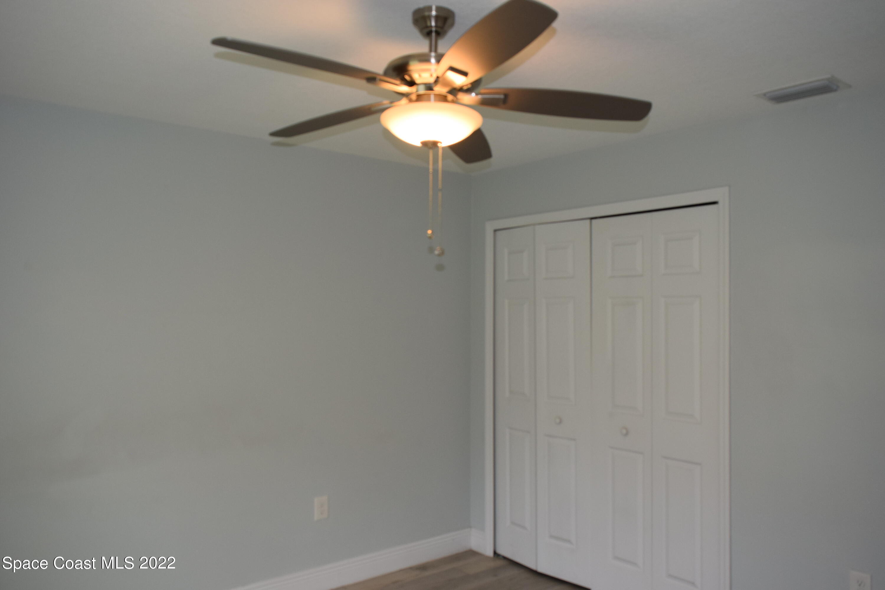 1328 Hazel Street Northwest Palm Bay, FL 32907 - Photo 19 of 28 a window in an empty room