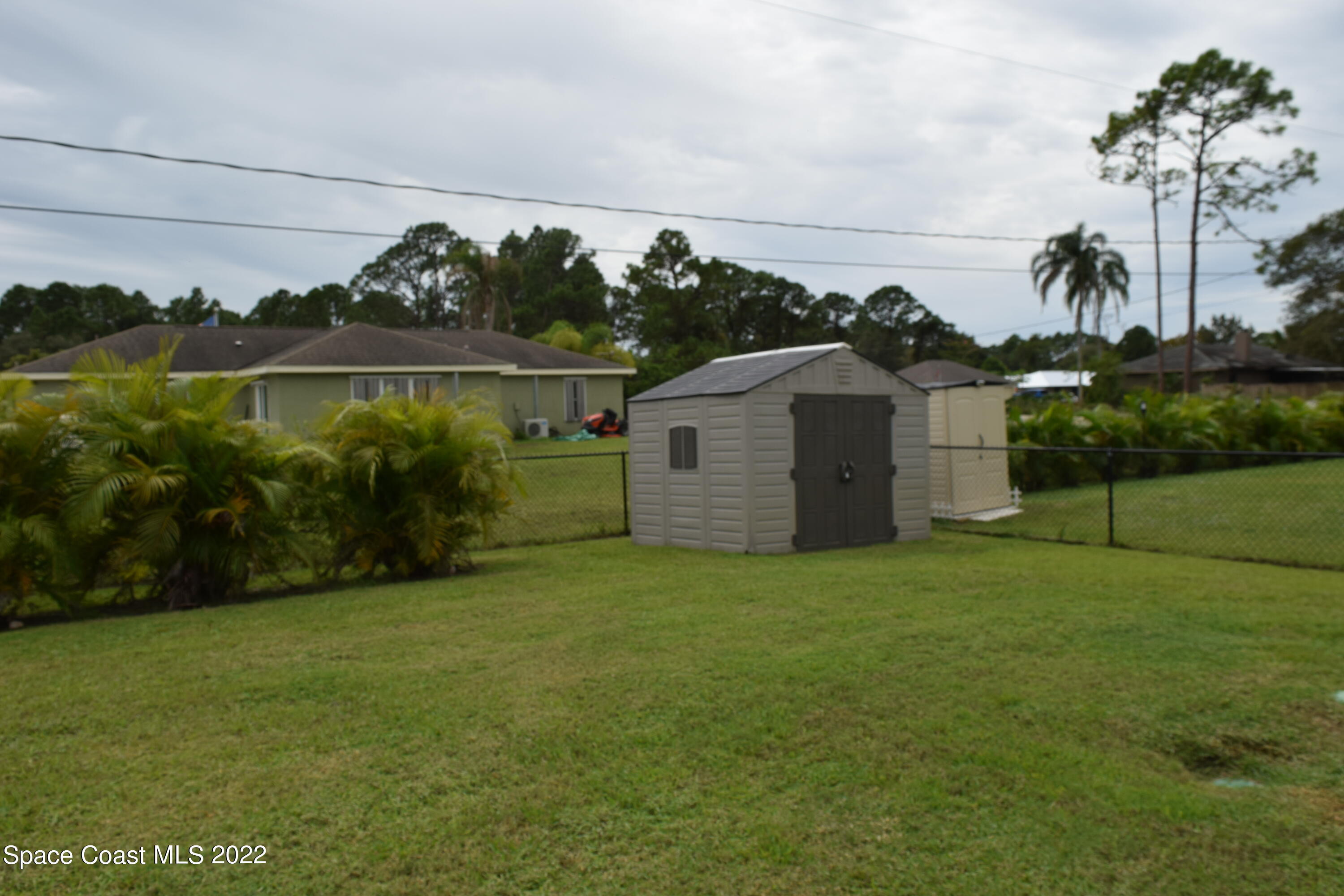 1328 Hazel Street Northwest Palm Bay, FL 32907 - Photo 28 of 28 a view of a backyard