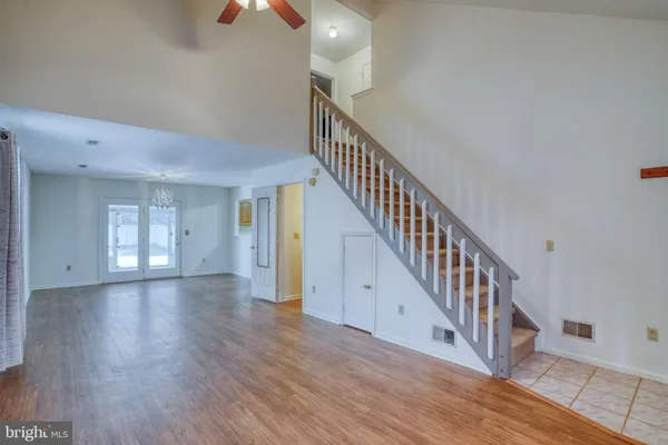 a view of an entryway with wooden floor