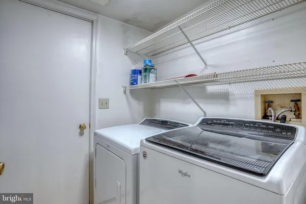 an empty room with sliding glass door and shower