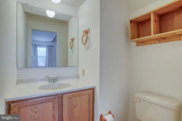 a view of a hallway with a door and fire place