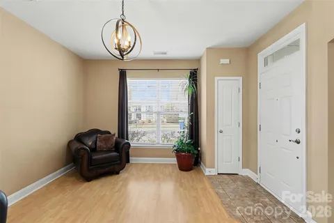 a view of a livingroom with furniture and windows