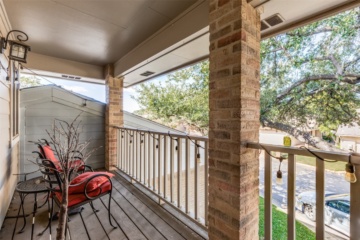11127 Pinehurst Drive, Unit C Austin, TX 78747 - Photo 19 of 25 a view of balcony with wooden floor