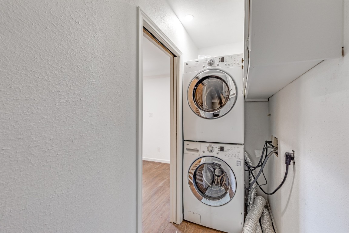 11127 Pinehurst Drive, Unit C Austin, TX 78747 - Photo 21 of 25 a utility room with dryer and washer