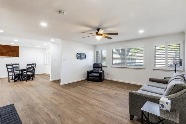 a view of a livingroom with furniture and a large window