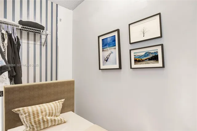 a view of a hallway with paintings on the wall