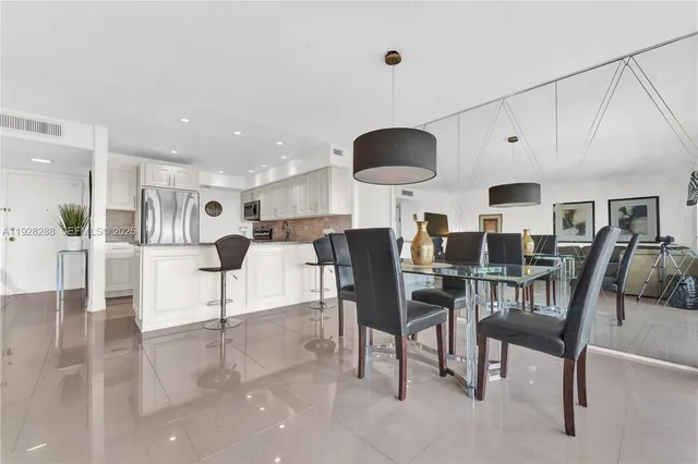 a view of a dining room and livingroom with furniture