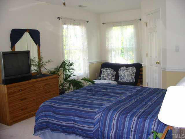 9016 Breeland Way Raleigh, NC 27613 - Photo 8 of 10 One of two upstairs bedrooms, each with ceiling fan & walk-in closet Other