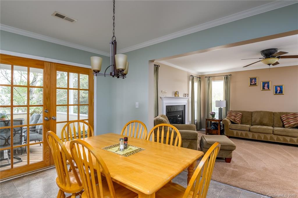 635 Eaton Court Fort Mill, SC 29708 - Photo 12 of 28 a view of a dining room with furniture window and outside view