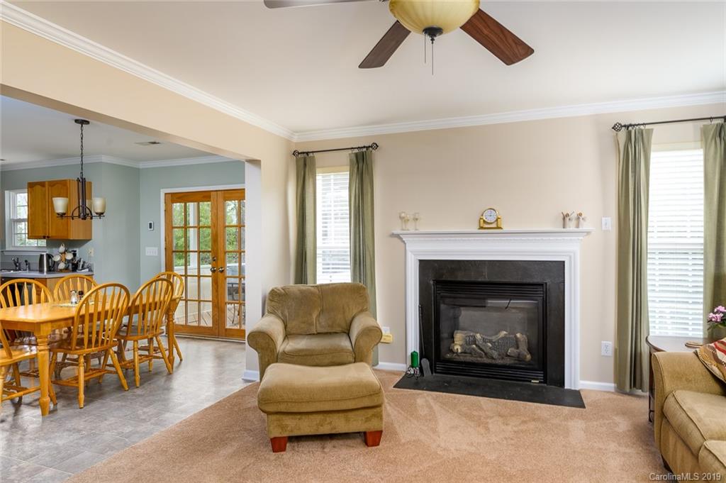 635 Eaton Court Fort Mill, SC 29708 - Photo 13 of 28 a living room with furniture and a fireplace