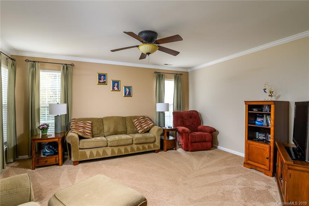 635 Eaton Court Fort Mill, SC 29708 - Photo 14 of 28 a living room with furniture and a flat screen tv