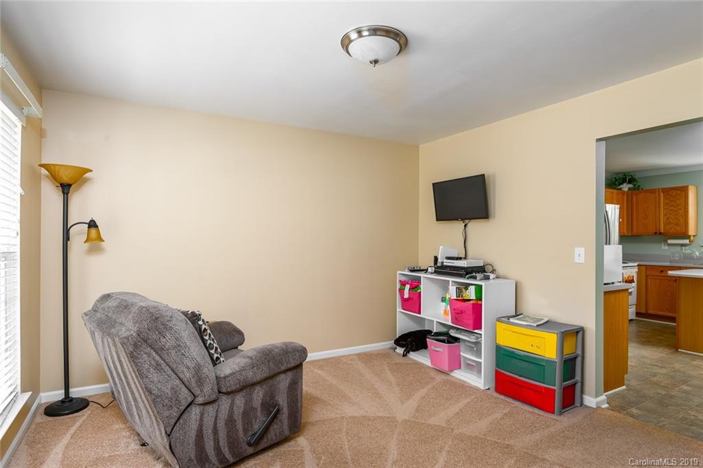 635 Eaton Court Fort Mill, SC 29708 - Photo 16 of 28 a living room with furniture and a baby crib
