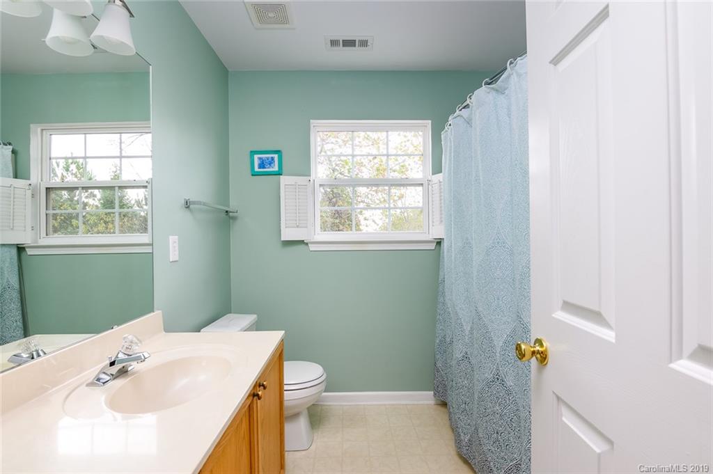 635 Eaton Court Fort Mill, SC 29708 - Photo 20 of 28 a bathroom with a sink a toilet and window
