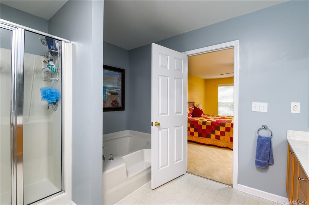 635 Eaton Court Fort Mill, SC 29708 - Photo 23 of 28 a view of walk in closet and bedroom