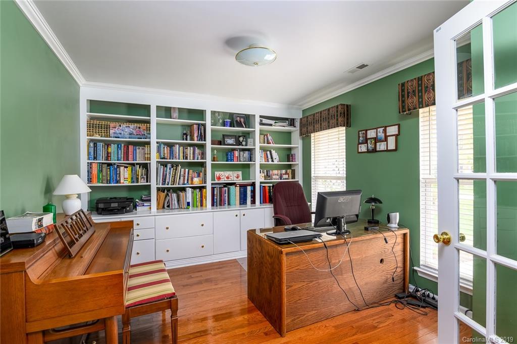 635 Eaton Court Fort Mill, SC 29708 - Photo 9 of 28 a room with furniture window and book shelf