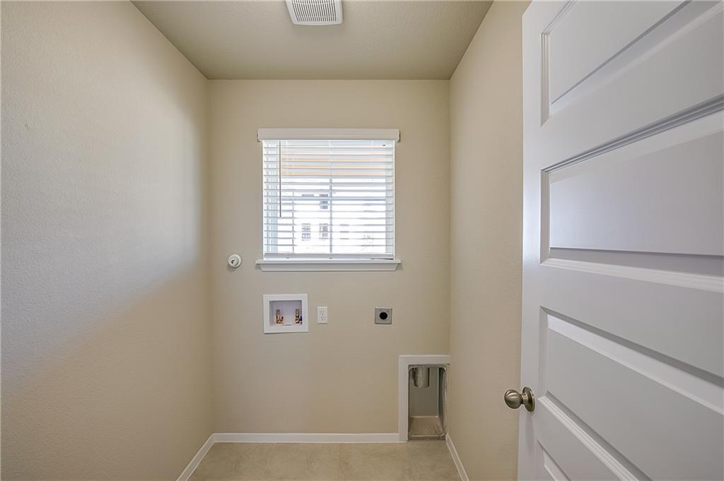 306 Delta Crest Maxwell, TX 78656 - Photo 20 of 24 a view of small space with racks on the wall