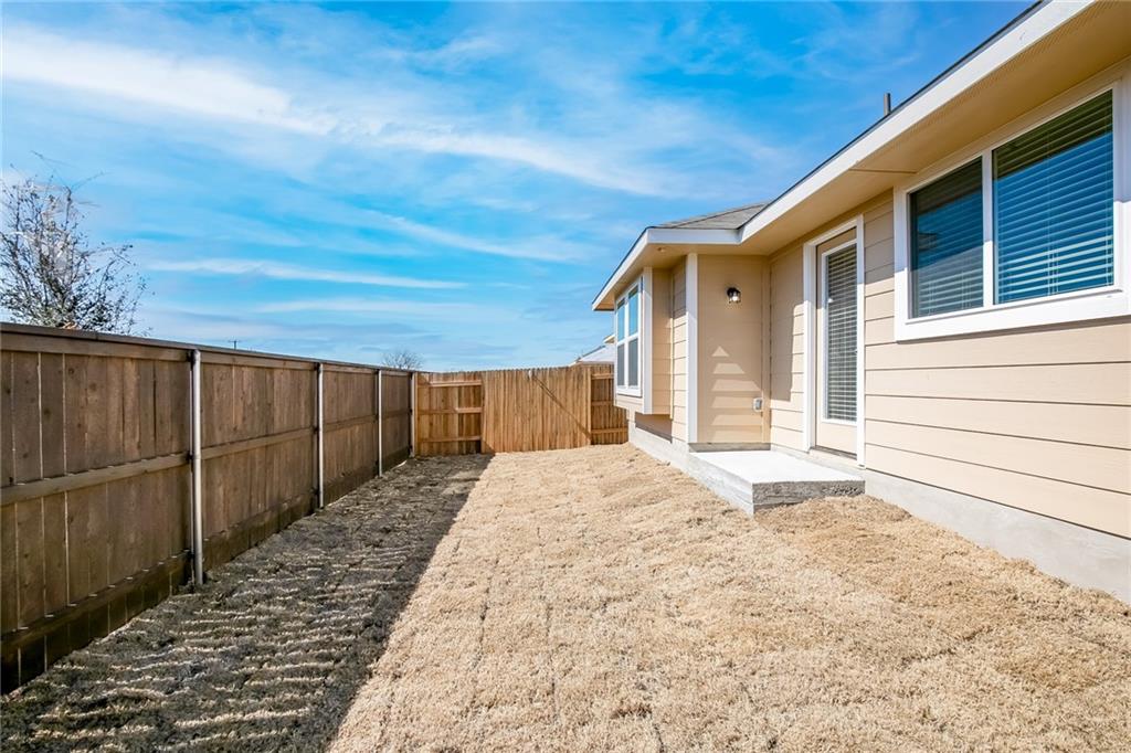 306 Delta Crest Maxwell, TX 78656 - Photo 23 of 24 a view of backyard with wooden fence