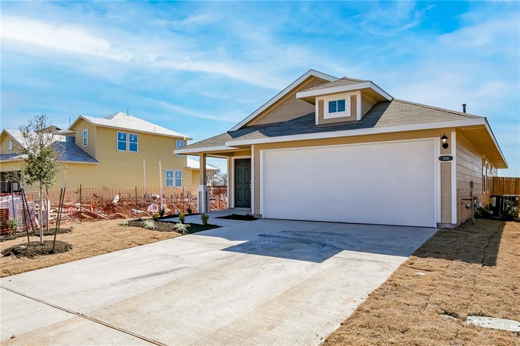 306 Delta Crest Maxwell, TX 78656 - Photo 3 of 24 a front view of a house with a yard