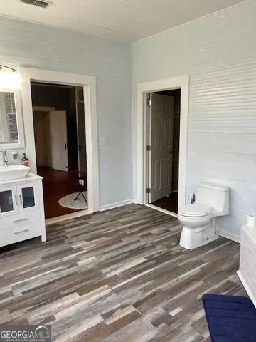 a view of a bedroom and a bathroom