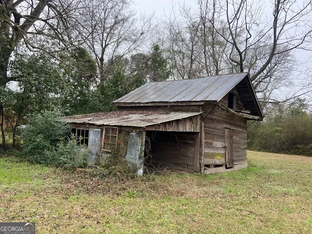 a view of a house with a tub and trees