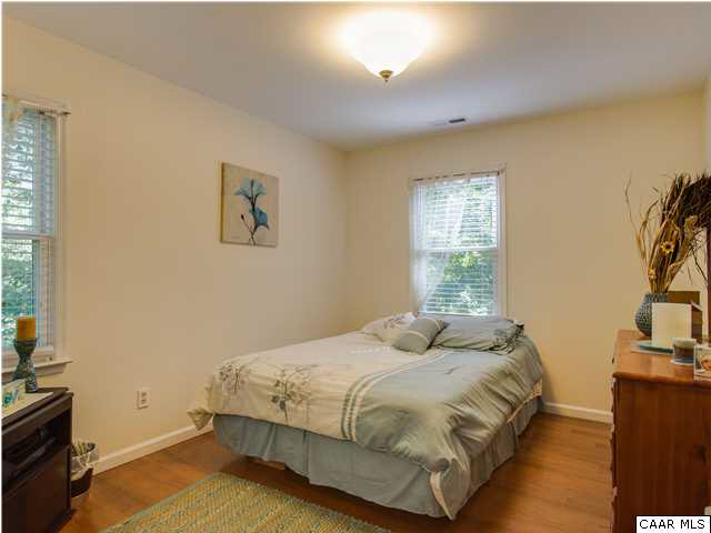 89 West Daffodil Road Ruckersville, VA 22968 - Photo 11 of 22 a bedroom with a bed and a flat tv screen on the dresser