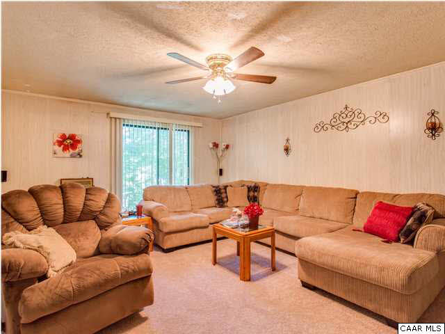 89 West Daffodil Road Ruckersville, VA 22968 - Photo 14 of 22 a living room with furniture and a large window