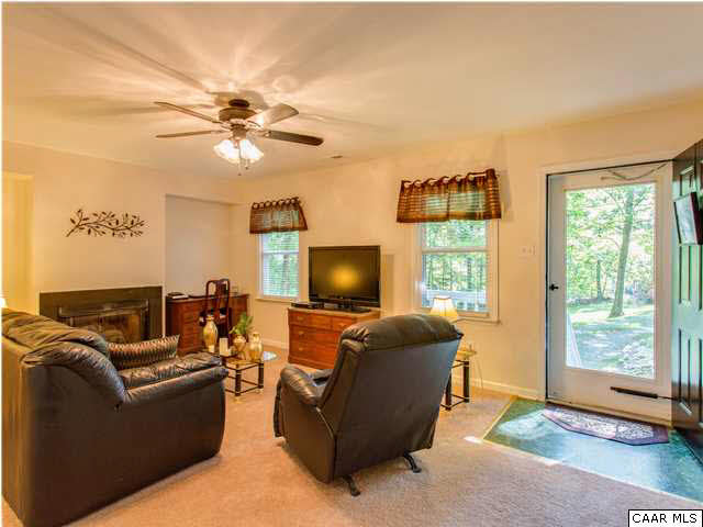 89 West Daffodil Road Ruckersville, VA 22968 - Photo 17 of 22 a living room with furniture and a flat screen tv