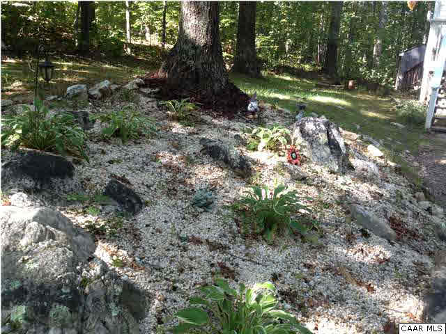 89 West Daffodil Road Ruckersville, VA 22968 - Photo 6 of 22 a backyard of a house with lots of green space