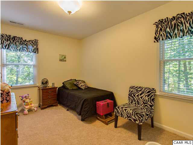 89 West Daffodil Road Ruckersville, VA 22968 - Photo 10 of 22 a bedroom with a bed and a window