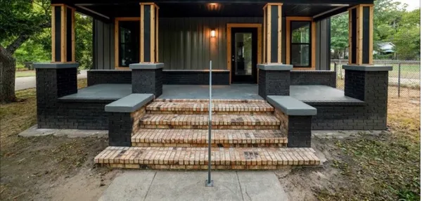 a front view of a house with a porch