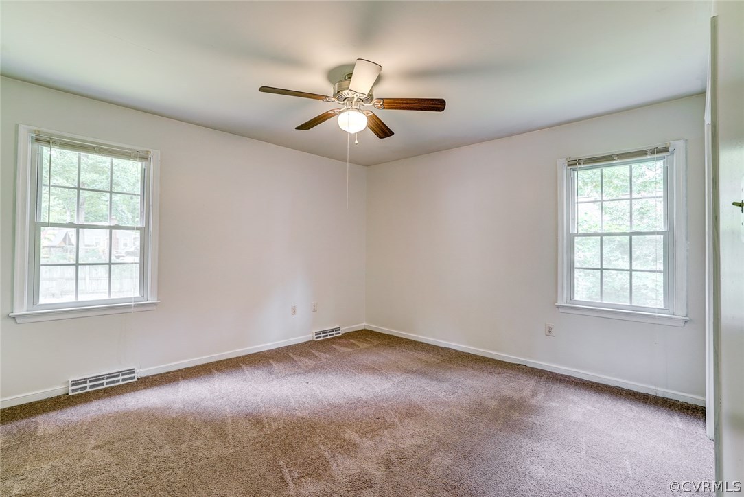 4800 Newbys Bridge Road Chesterfield, VA 23832 - Photo 20 of 37 an empty room with windows and fan