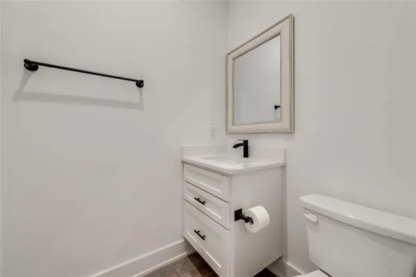 a living room with furniture fireplace and a potted plant