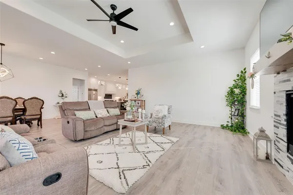 a view of a dining room kitchen and a chandelier