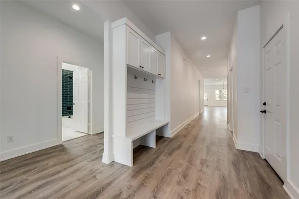 a view of a kitchen with a sink and chandelier
