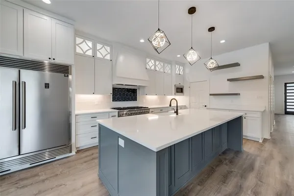 a close view of a stove a microwave and cabinets in the kitchen