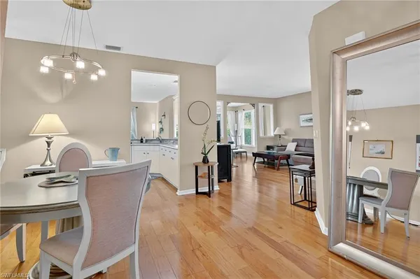 a view of a dining room with furniture and wooden floor