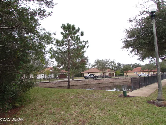 a view of swimming pool with outdoor seating and yard