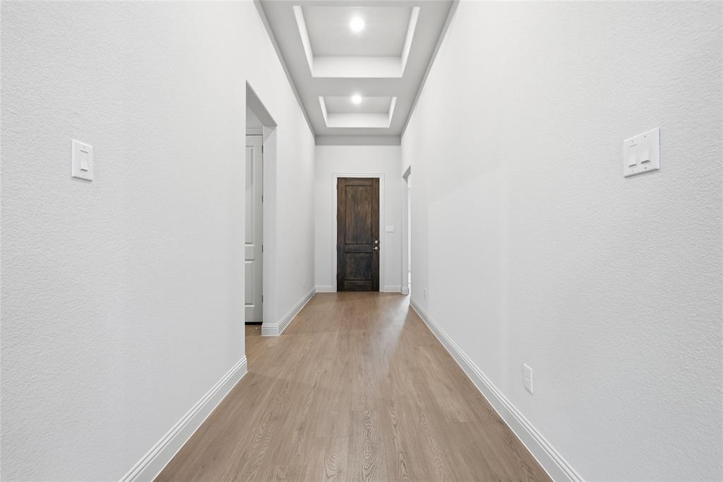 556 Flint Road Waxahachie, TX 75167 - Photo 13 of 39 a view of hallway with wooden floor