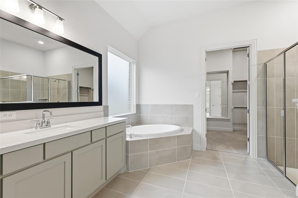 556 Flint Road Waxahachie, TX 75167 - Photo 27 of 39 a bathroom with a sink and a mirror