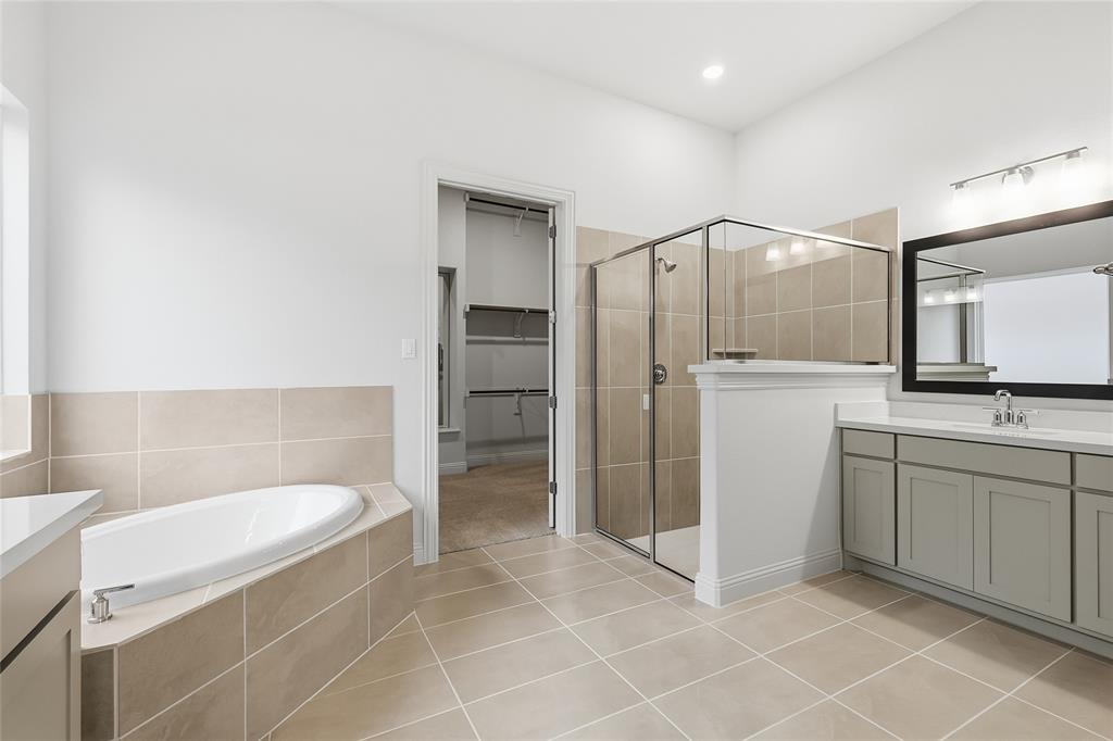 556 Flint Road Waxahachie, TX 75167 - Photo 28 of 39 a bathroom with a sink a toilet and shower