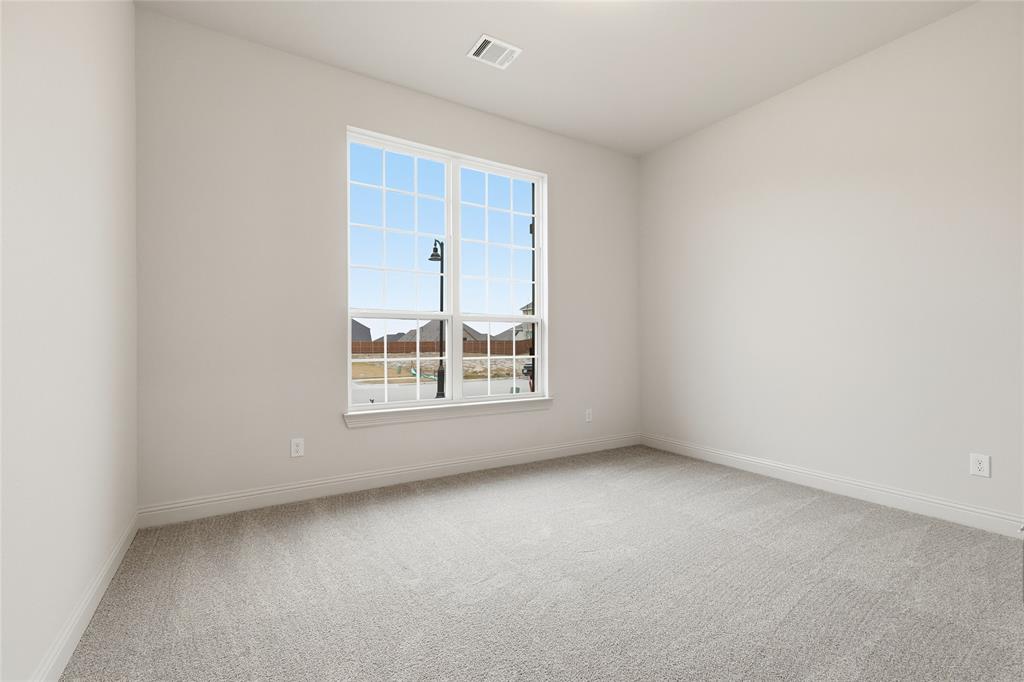 556 Flint Road Waxahachie, TX 75167 - Photo 4 of 39 an empty room with a window