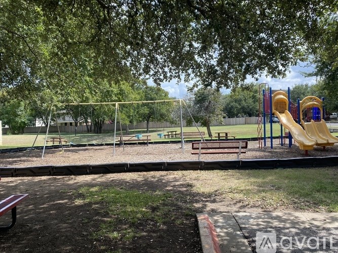 2120 Jester Farms Road Round Rock, TX 78664 - Photo 28 of 28 A community playground, surrounded by mature trees, provides ample space for recreation and enjoyment.