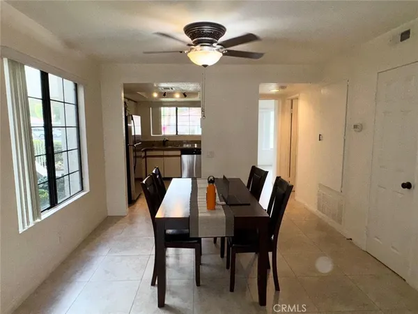 a dining room with furniture and window