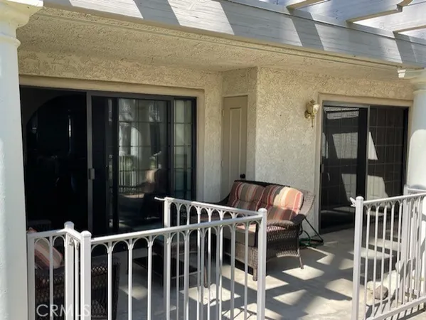 a view of a balcony with chairs