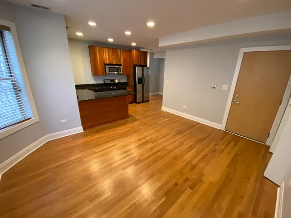 a view of kitchen and refrigerator