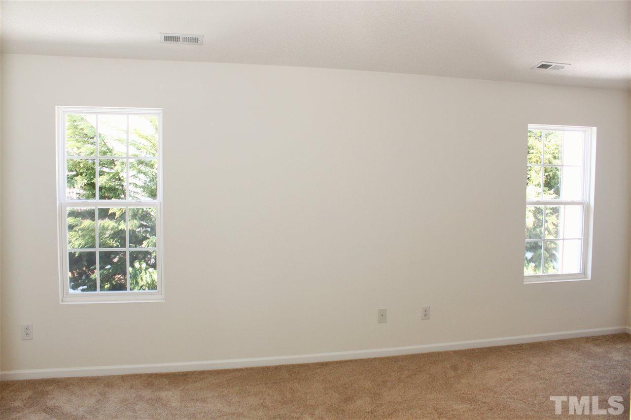 3043 Settle In Lane Raleigh, NC 27614 - Photo 11 of 19 an empty room with a window