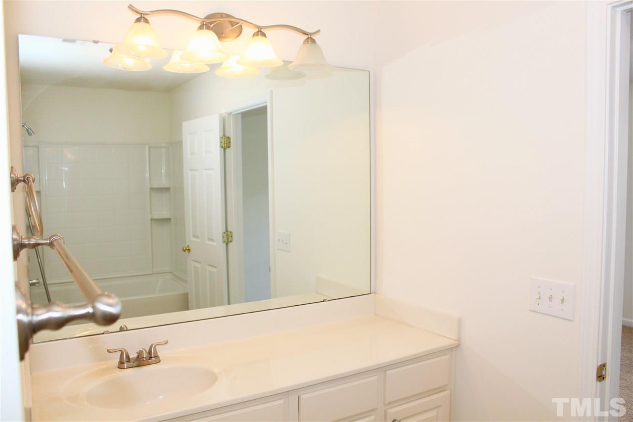 3043 Settle In Lane Raleigh, NC 27614 - Photo 12 of 19 a bathroom with a sink and a mirror