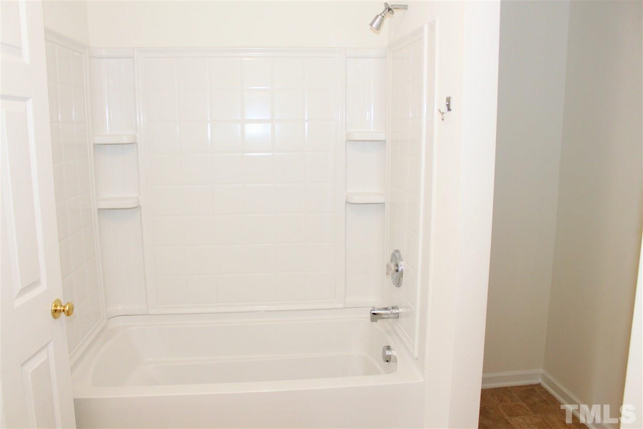 3043 Settle In Lane Raleigh, NC 27614 - Photo 17 of 19 a bathroom with a bathtub